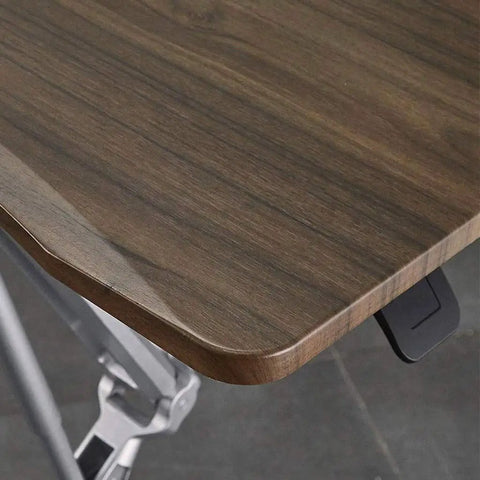 Close-up of the wooden surface of the Slick Rolling Mobile Laptop Desk Cart With Pneumatic Height Adjustable Sit Stand Ergonomic Wood Platform.