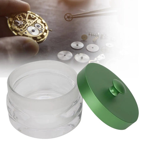 Pro Grade Glass Watch Movement Cleaning Jar with spill-proof lid, durable oil washing container for horologists shown.