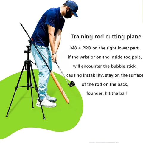Man using Golf Swing Training Kit With Phone Holder Lightweight 360 Degree Alignment Sticks Tripod Stand for practice analysis.