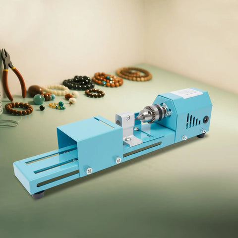 Compact Mini Lathe Machine For Table Workbench Precision Wood Turning Milling Tool With 96W Copper Motor, blue with crafting tools and beads.