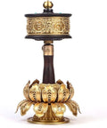 Copper Hand Held Prayer Wheel For Home And Office Decor with wood handle and engraved Tibetan design, lotus base.