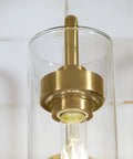 Purist 1 Light Sconce with rounded glass shade and tubular metal base, modern wall lighting for damp areas, E26 bulb required