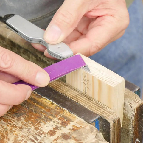 Using Diamond Sharpener Kit With Three Grit Pads 1200, 600, 400 For Carbide Blades on wood in workshop.