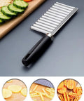 Angled side view of crinkle cutter knife with black handle and stainless steel wavy blade for slicing potatoes and vegetables.