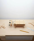 Solid Beech Wood Portable Workbench Vise And Bench Clamp Tool For DIY Pros on a workbench with wood pieces.