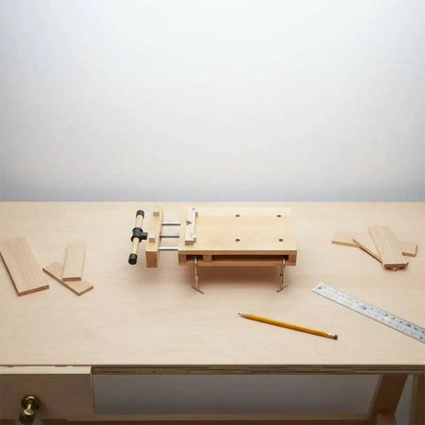 Solid Beech Wood Portable Workbench Vise And Bench Clamp Tool For DIY Pros on a workbench with wood pieces.