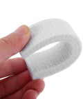 Hand holding a piece of 4 Pack Felt Brake Pads For Indoor Cycling Replaceable Wool Blocks For Exercise Bikes Compatible With Electric And Road Bikes Durable Low Noise Performance For Sturdy Fitness Equipment.