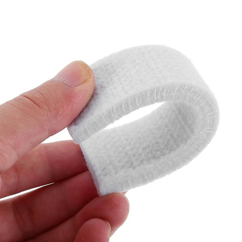 Hand holding a piece of 4 Pack Felt Brake Pads For Indoor Cycling Replaceable Wool Blocks For Exercise Bikes Compatible With Electric And Road Bikes Durable Low Noise Performance For Sturdy Fitness Equipment.