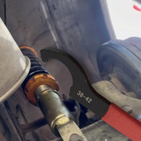 Using Nine Piece Coilover Spanner Wrench Set For Adjustable Shocks Universal Carbon Steel Wrenches to adjust car suspension