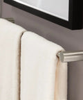Align 24-Inch Modern Single Towel Bar In Brushed Nickel, wall-mounted with white towels in bathroom.
