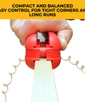 Quad Pro Pneumatic Edge Trimmer With Tungsten Carbide Blades Trims From One Half Inch To One And One Quarter Inch No Springs Attached Trims All Directions Ultra Smooth Action Red Finish in use.