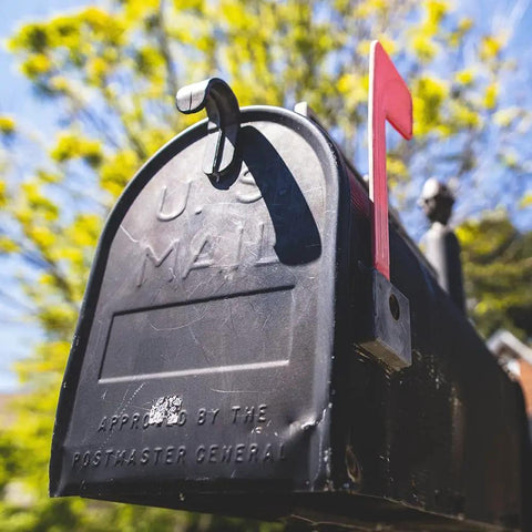 Mailbox Latch Replacement Kit For Group Standard And Post Mailboxes shown on a black metal mailbox with red flag