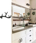 Straight Outta The Woods Dead Ringer Heavy Duty Cast Iron Deer Antler Wall Mount Coat Hooks in stylish bathroom setting.