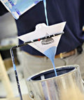 Person pouring paint through Cone Strainer Set, Medium Mesh 226 Micron, 1000 Count White into a metal container