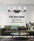 Set of 4 Oil Rubbed Bronze Wall Sconces With Clear Glass Cylinders above modern living room sofa
