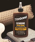 Top Tier Liquid Hide Glue For Fine Woodworking And Furniture Restoration Quick Setting Reversible Adhesive 8 Ounce Bottle shown on wood surface.