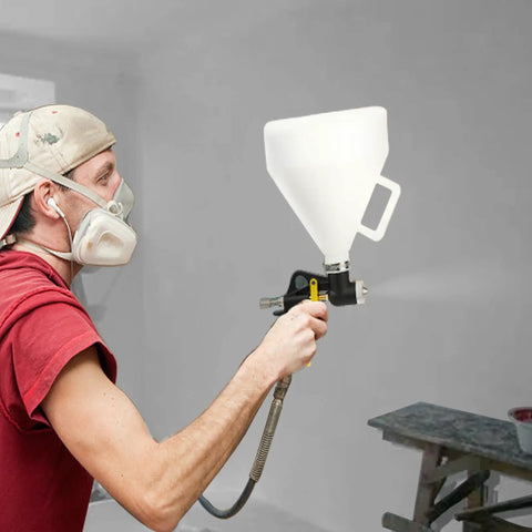 Pro Grade Air Texture Sprayer Featuring An Extended Swing Lever And Three Interchangeable Nozzles For Dead Smooth Wall Finishes in use.
