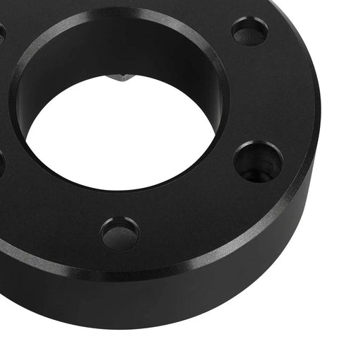 Close-up of T6 billet aluminum strut block for leveling kit, featured in black finish, designed for Chevy Silverado 1500 and GMC Sierra 1500 trucks.