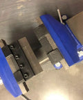 4 Inch Vise Mount Press Brake Bender Attachment for Sheet Metal Cross Slide, shown clamped in a blue vise, top view.