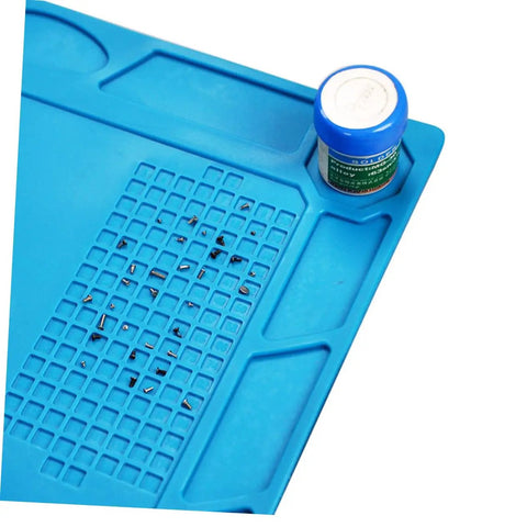 Top Notch Silicone Repair Mat With Heat Resistant Non Slip Surface And Precision Pin Layout For Soldering Stations Laminating Machines And No Sweat Tech Fixes showing blue silicone mat with organized screws and small container.