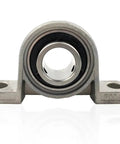 Built Tough Four Piece KP08 KP000 To KP006 Bearing Shaft Support Kit Using Zinc Alloy Spherical Roller Housing Designed For Vertical Pillow Block Mount Up To Keep Everything Rolling Smooth Like Butter In Your Shop, front view