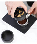 Total Game Changer 58mm Coffee Distributor Needle Tool For Portafilter Leveling, solid aluminum, black finish, in use prepping coffee.