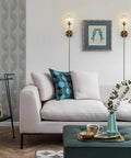 Living room scene with Brushed Gold Plug In Wall Sconce Set Of 2 Mid Century Modern Long Globe Lights With Amber Glass above sofa