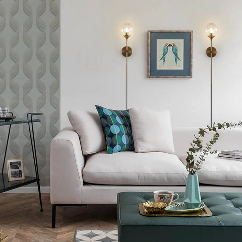 Living room scene with Brushed Gold Plug In Wall Sconce Set Of 2 Mid Century Modern Long Globe Lights With Amber Glass above sofa