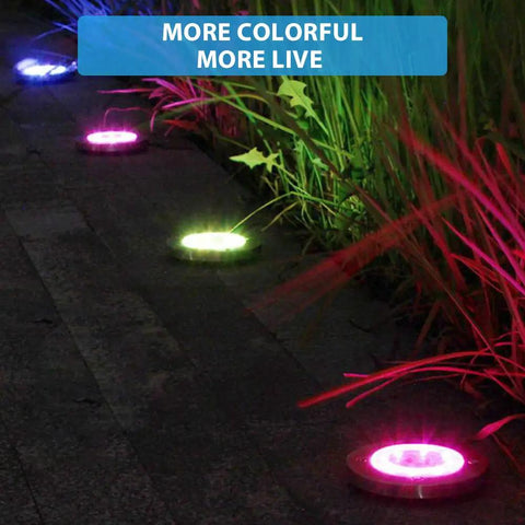 Colorful glow of Solar Ground Lights Outdoor With 12 LEDs Auto Changing Multi Color Cool Glow Garden Pathway Lights along a path.