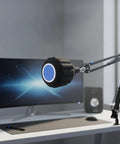 Top Shelf Acoustic Foam Microphone Windscreen And Pop Filter For Podcasting Creators And Live Streamers Chasing Crystal Clear Vocals With Tight Plosive Shielding In Sleek Black mounted on microphone arm near computer monitor.