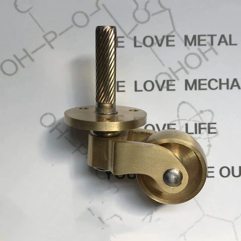 Retro Polished Brass Furniture Casters 25Millimeter Swivel Wheel Rollers For Kitchen Cupboards And Cabinets with a threaded steel stem.