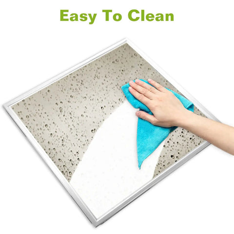 Hand cleaning 2 By 2 Ft LED Flat Panel Light For Drop Ceiling Office Use with cloth, illustrating easy maintenance.