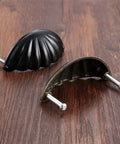 One Piece Zinc Alloy Kitchen Drawer Cabinet Door Handle Knob With Antique Bronze And Black Finish on wooden surface