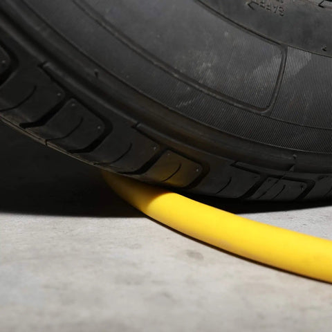 Three Eighth Inch Lead In Air Hose Six Feet Long With One Quarter NPT Quick Coupler And Plug 300 PSI Yellow Whip Compressor Hose Short under a tire