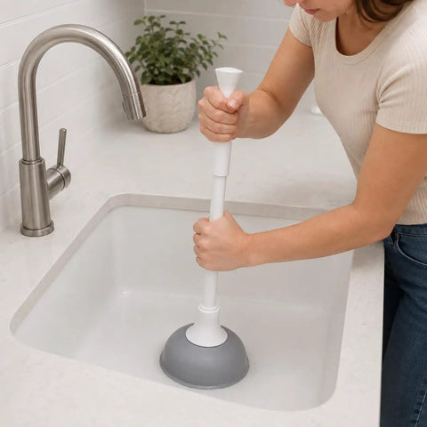 Slick Modern Toilet Plunger With 19 Inch Handle And Gray Rubber Cup Kicks Clogs Fast And Features A Snazzy Three Piece Design in use.