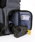 DSLR Waterproof Camera Backpack with Large Capacity Anti Theft Design, open pocket holding smartphone and camera lens