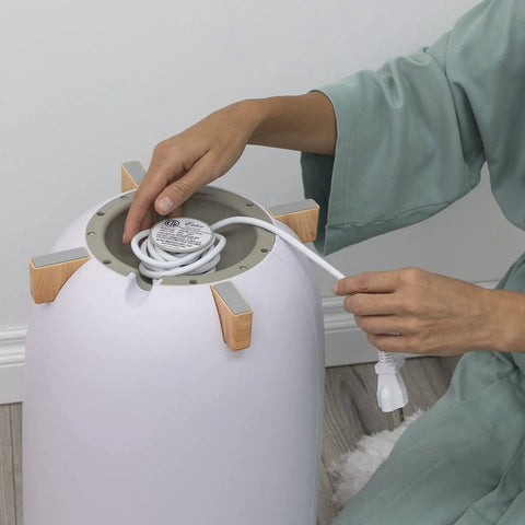 Person handling cord of Large Towel Warmer Bucket With Timer Auto Shut Off Electric Spa Warmer For Bathroom Home Spa Vibe