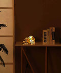 Tiffany Style Stained Glass Accent Dog Table Lamp for Home Decor orange lit pup vibe on a side table, warm glow.
