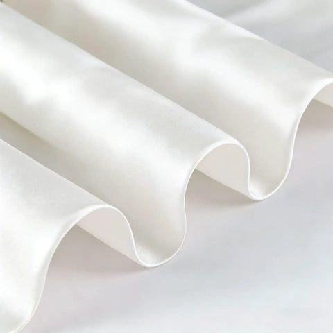 Close-up of white wave-like fabric texture, highlighting breathable 22x22 inch square bandana for adults built for camping and RV trips.