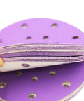 Get Ready To Polish Like A Pro With This Awesome 100 Piece 6 Inch Wet Dry Hook And Loop Sanding Discs Assortment Featuring 320 Grit Plus Many More For Wood Drywall And Metal Projects That Suck Less, showcasing purple 6-inch sanding disc with holes.