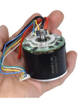 Cool 12V Brushless Motor With Big Neodymium Mag For Industrial Or DIY Work held in hand showing wires and internal structure.