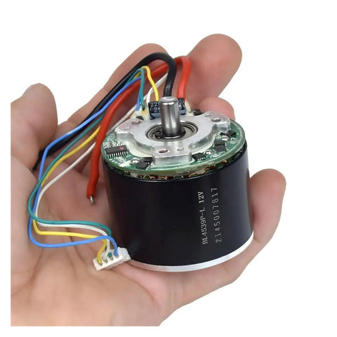Cool 12V Brushless Motor With Big Neodymium Mag For Industrial Or DIY Work held in hand showing wires and internal structure.