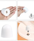 Universal Toilet Bolt Caps Pack of 6, White 1.44 Inch Round Push On Covers With Washers, Easy Snap On Installation shown in hand and on floor bolt