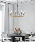 Modern Gold 8 Light Chandelier With Candlestick Lights in dining room over table, featuring farmhouse style design.
