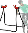 Foldable Aluminum Bike Repair Stand For DIY Home Mechanics with Easy Foldout Legs, Mounts On Rear Hub Axle, shown next to a cyclist.