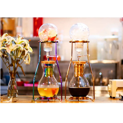 Craft Hella Smooth Cold Brew Coffee And Iced Tea With This No Sweat Dripper Featuring Adjustable Water Flow Stainless Steel Filter And Spacious Glass Carafe For Daily Sipping, showcasing two stylish drippers.
