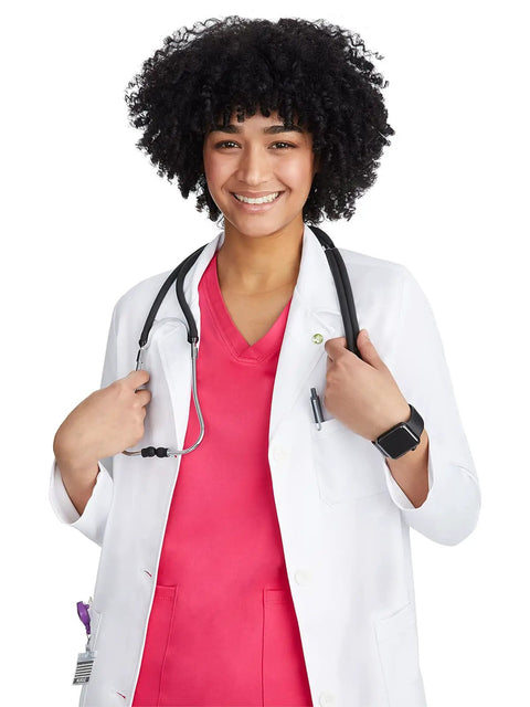 Smiling woman wearing Women's White Lab Coat With Five Pockets Moisture Wicking Two Way Stretch Relaxed Full Length Fit