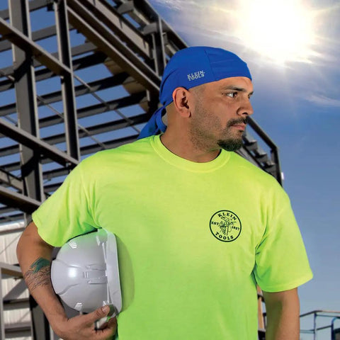 Worker wearing blue cooling bandana sweat wicking skull cap under helmet adjustable 2-pack elastic band performance fabric