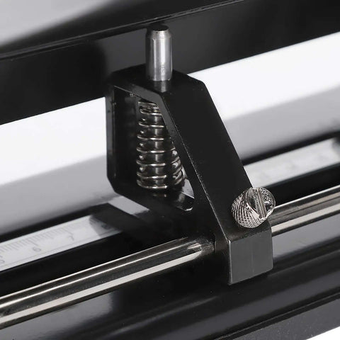 Close-up of Heavy Duty 4 Hole Paper Punch With Built In Ruler For Up To 30 Sheets Adjustable Manual Hole Puncher showcasing adjustment mechanism.