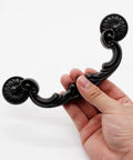 Holding a vintage style zinc alloy drop down bail pull handle, part of the set of 4 rustic handles with 151mm hole center, 185mm length.
